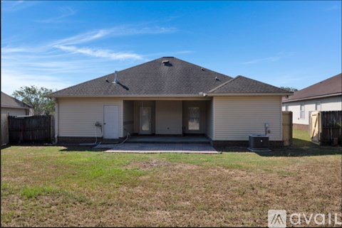 A house with a brown roof and a white garage door is for sale.