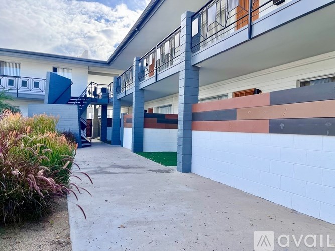 A building with a blue and white striped wall.