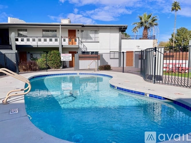 A pool in front of a house with a sign that says "available".