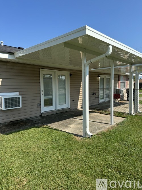 A house with a covered porch and a white door.