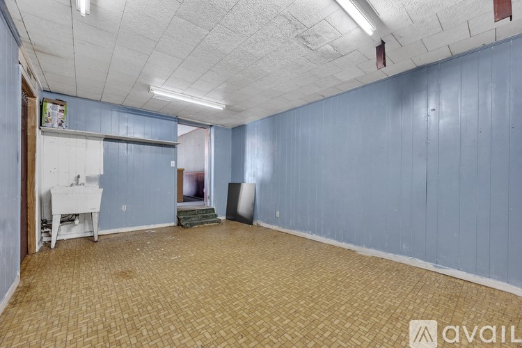 A room with blue walls and a white table.