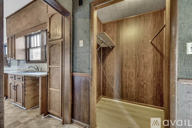 A wooden door with a window on the other side.