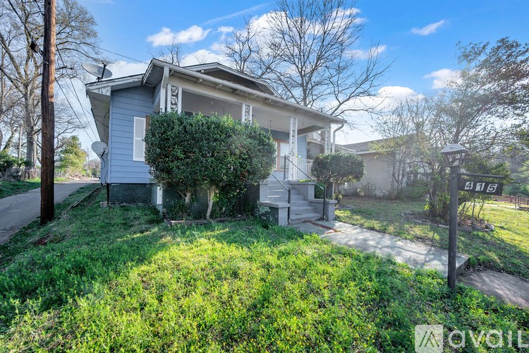 A house with a sign that says "available" in front of it.