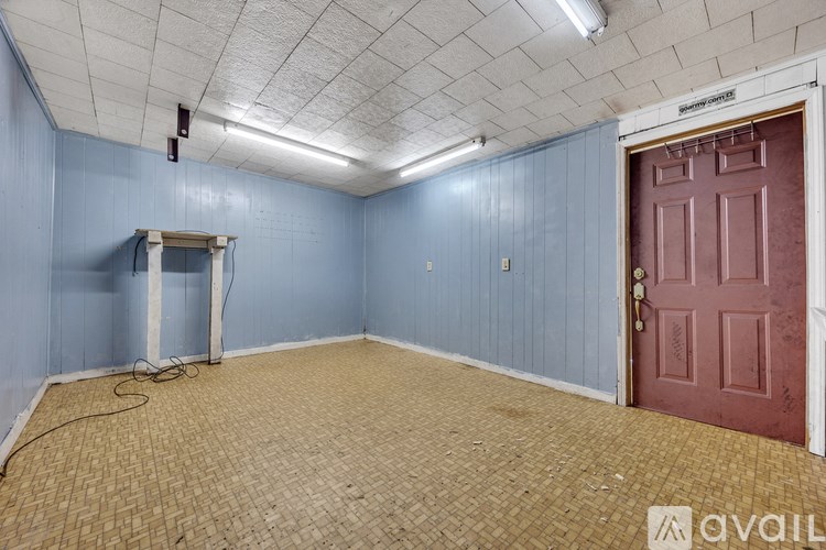 A room with a red door and a white door frame.
