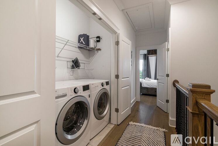 A laundry room with a washer and dryer in it.