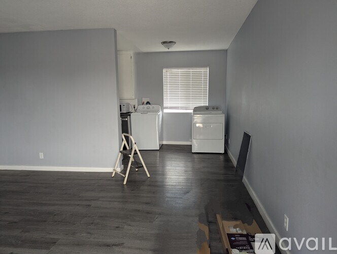 A kitchen with a white refrigerator and a white dishwasher.
