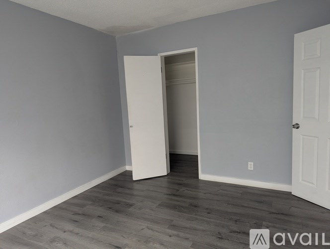 A room with a white door and a white door frame.