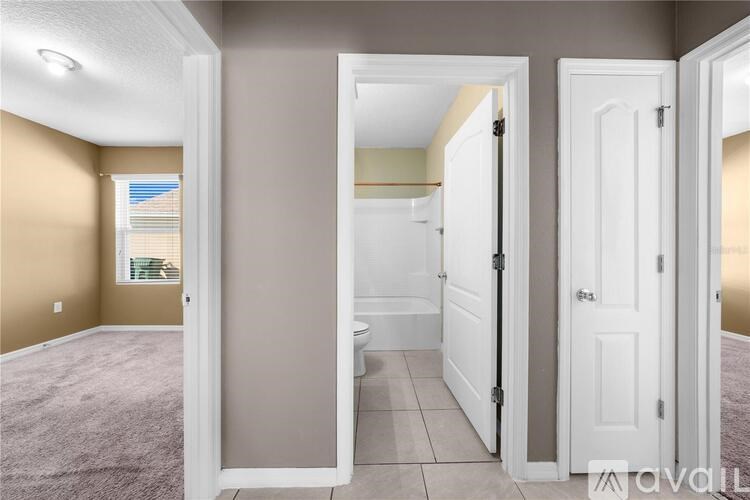 A bathroom with a toilet, sink, and bathtub is shown.