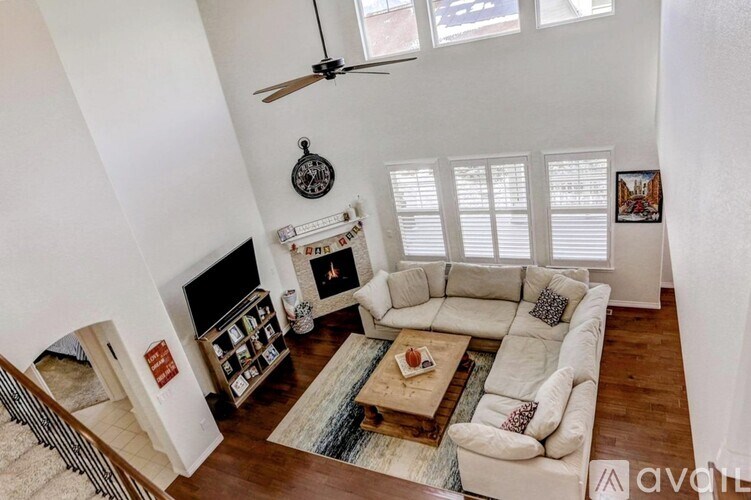 A living room with a fireplace and a couch.