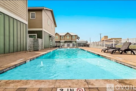 A pool with a 3-foot no swimming sign in the foreground.