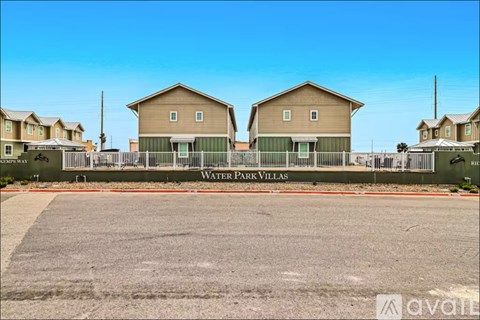 A housing development named Water Park Villas is shown with a clear blue sky above.