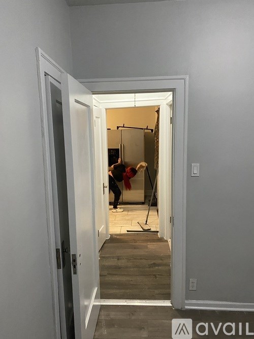 A room with a white door and a sign that says "available".