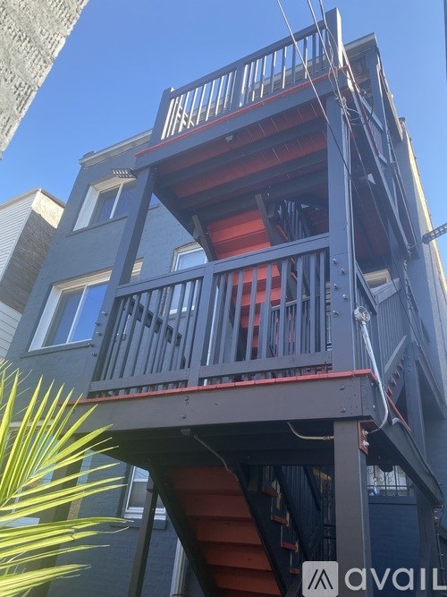 A multi-level building with a red staircase.