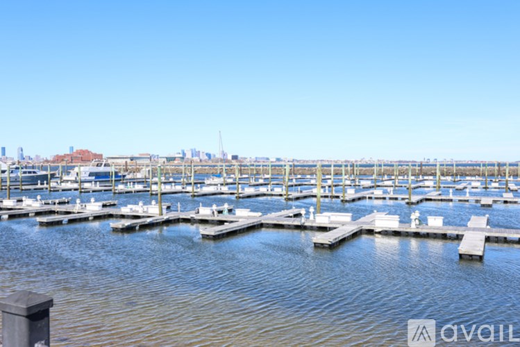 A marina with boats docked at the pier.