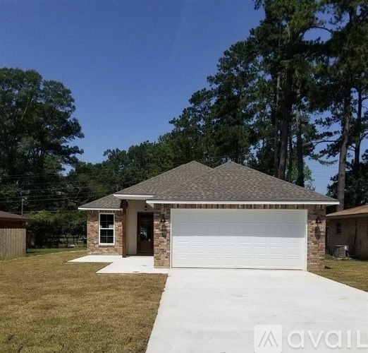 A house with a white garage door is for sale.