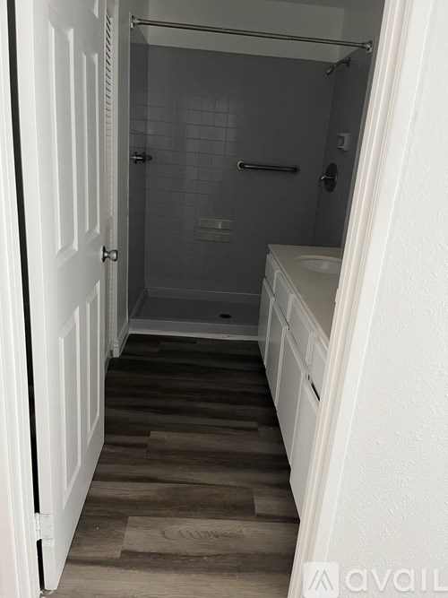 A bathroom with a walk in shower and a toilet.