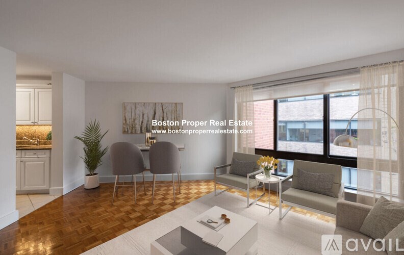 A modern living room with a large window and a view of the city.