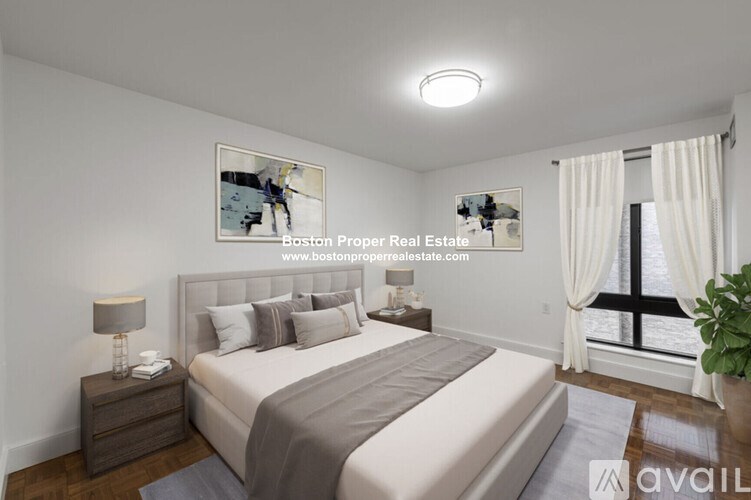 A bedroom with a large bed and a painting on the wall.