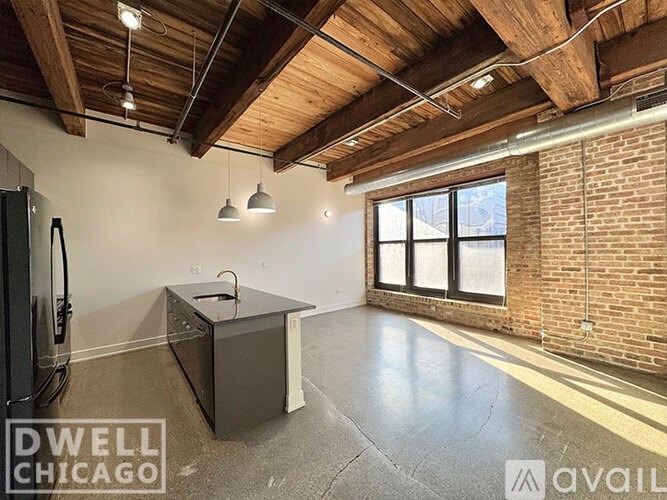 A room with a brick wall and a wooden ceiling.