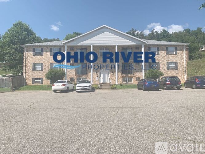 The front of the Ohio River Properties LLC building with cars parked in front.