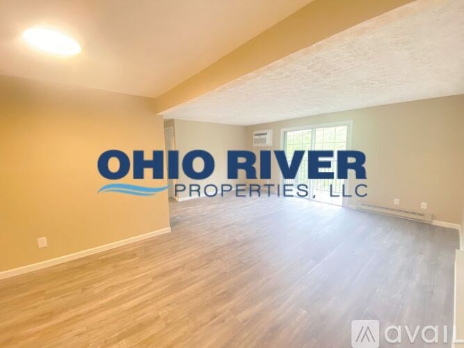 A room with a logo that says "Ohio River Properties, LLC" on the wall.