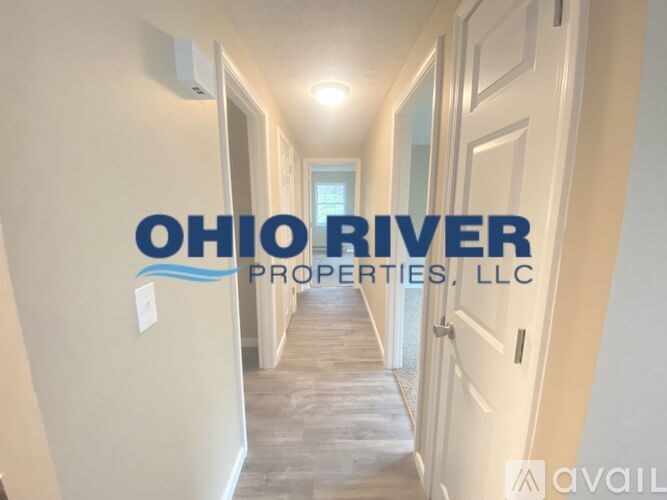 A hallway with the words "Ohio River Properties, LLC" on the wall.