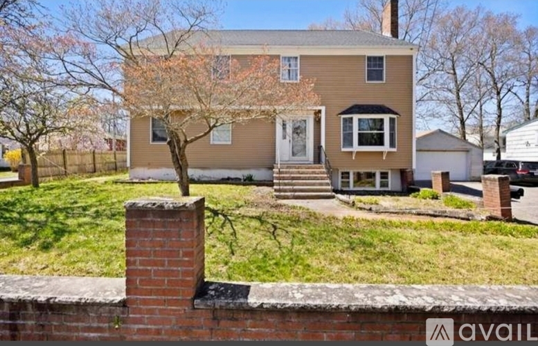 A house with a brick chimney is for sale.