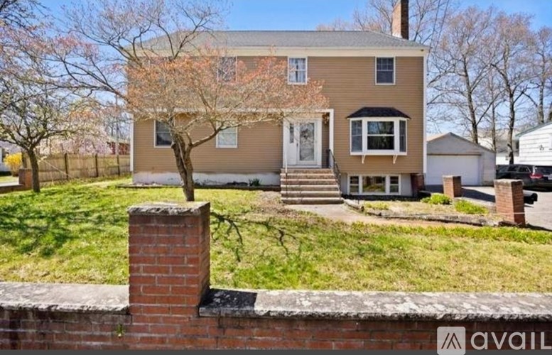 A house with a brick chimney is for sale.