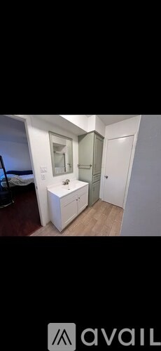 A bathroom with a sink and mirror.