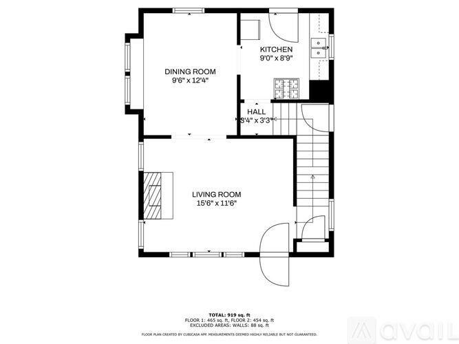 A floor plan of a house with a living room, dining room, kitchen and hall.