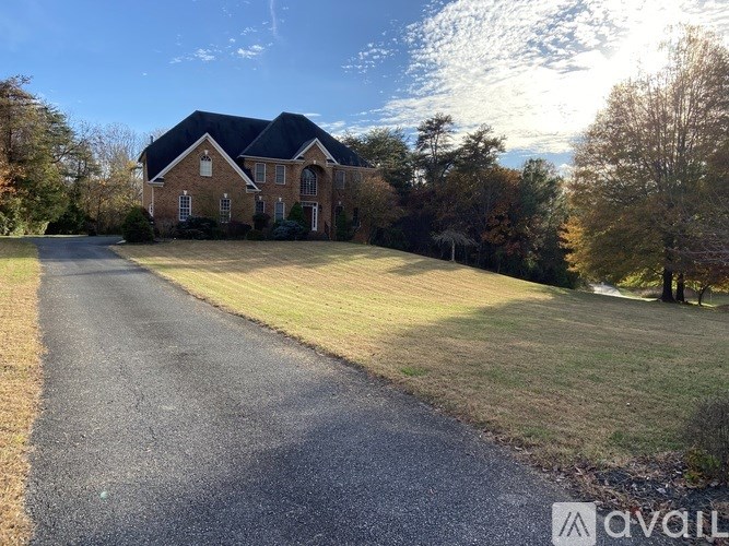 A large kitchen with wooden cabinets and a center island.