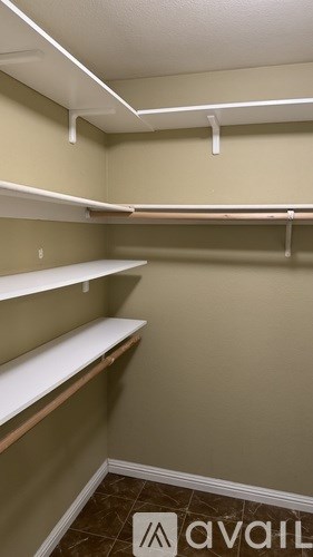 Empty white shelves in a room.
