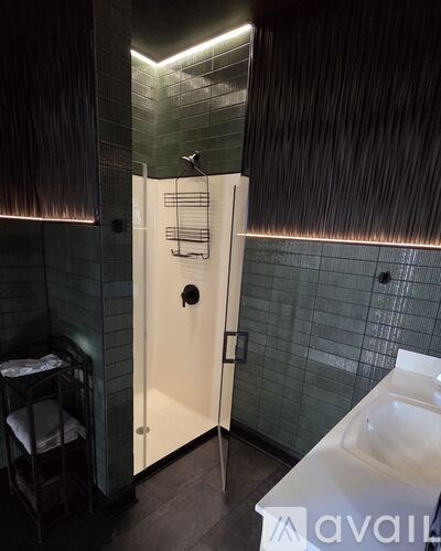 A bathroom with a white tub and a walk in shower.