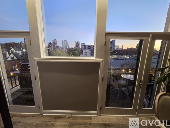 A window with a view of a city skyline.