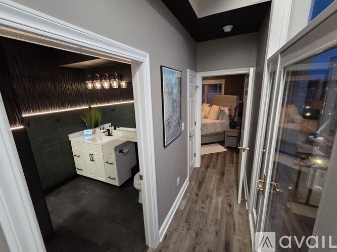 A bathroom with a vanity and a mirror.