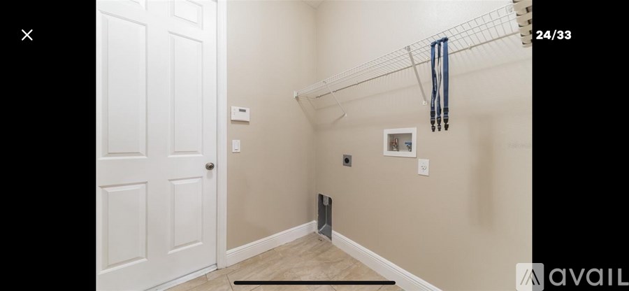 A white door is on the left side of the image.