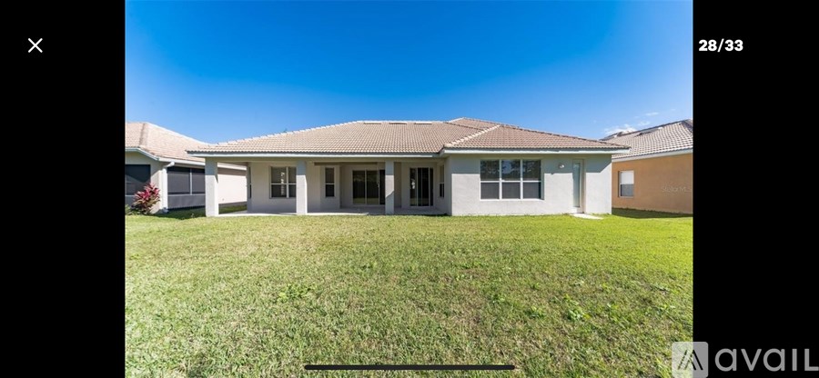 A house with a lawn in front is available for rent.