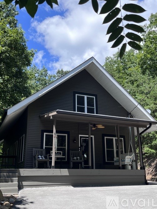 A house with a porch and a covered entrance.