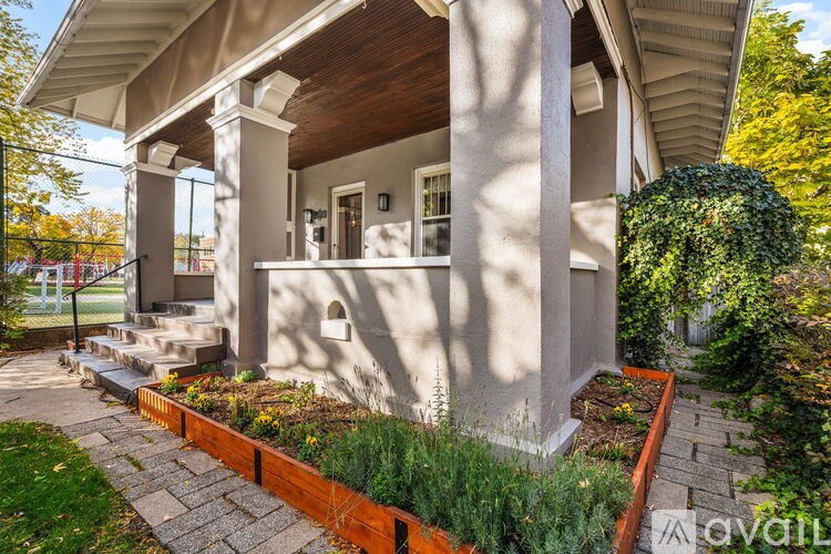 A house with a front porch and a garden.