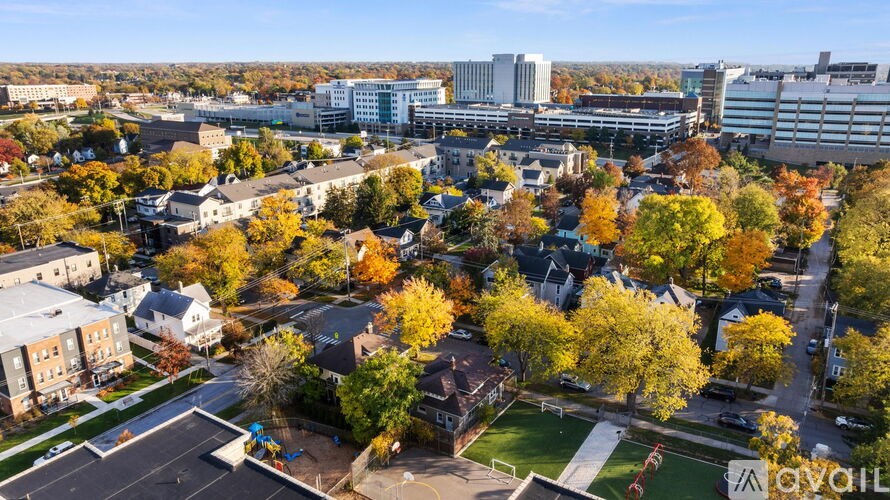 A bird's eye view of a residential area with trees in autumn colors.