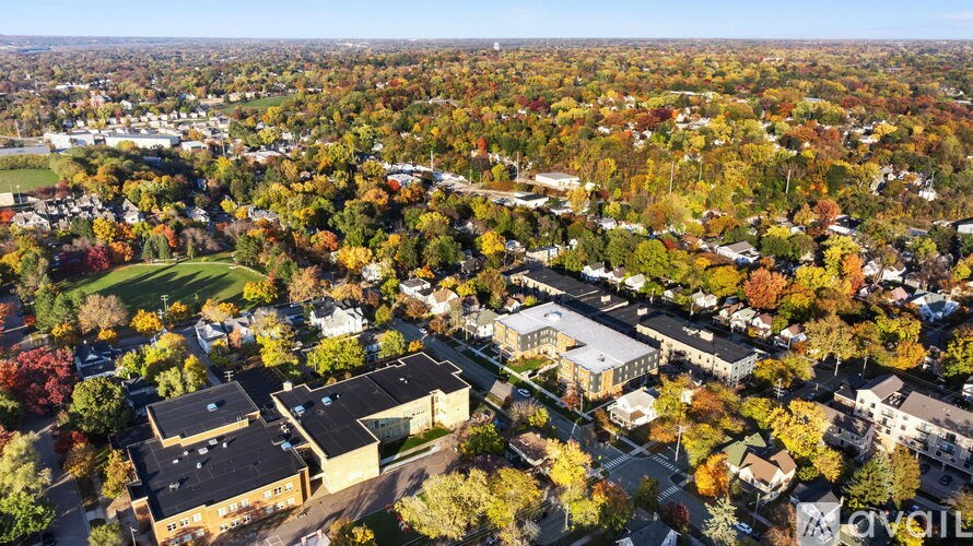 A bird's eye view of a residential area with houses and trees.