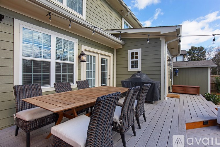 A patio with a table and chairs is available for rent.