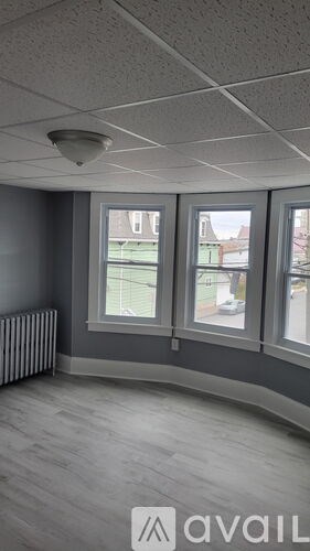 A room with a window and a radiator.