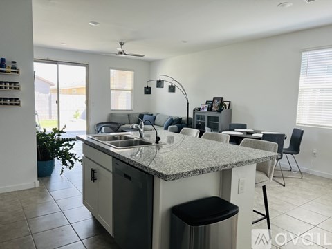 A kitchen with granite countertops and a sink.