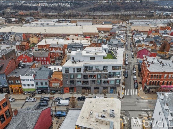 A city street with cars and buildings.