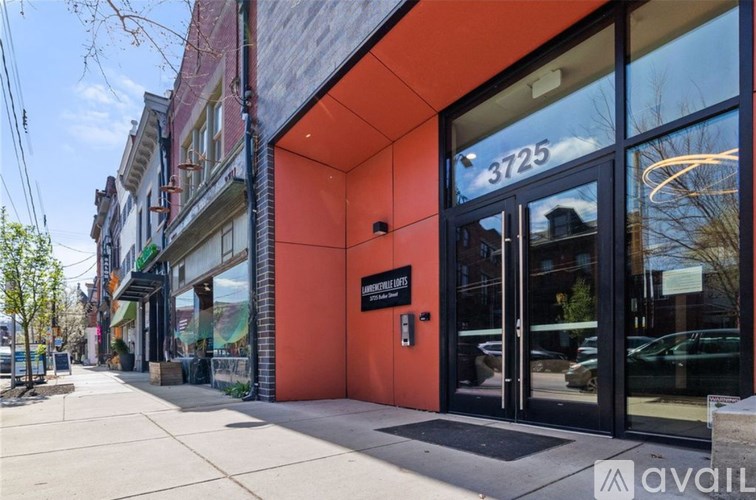 A street view of a building with the number 3725 on it.