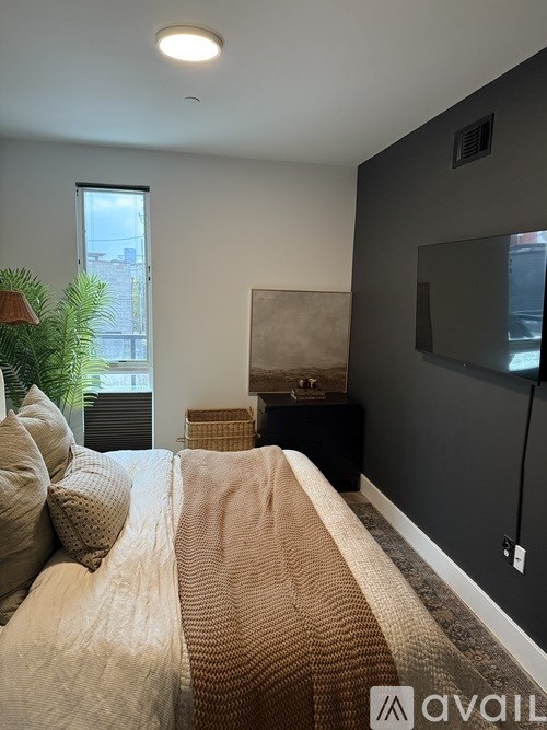 A small room with a bunk bed and a chair.