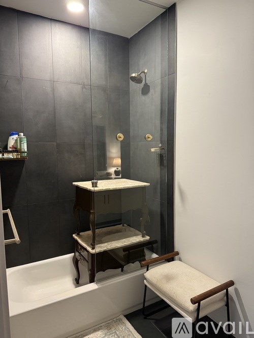 A patio with a table and chairs under a large umbrella.