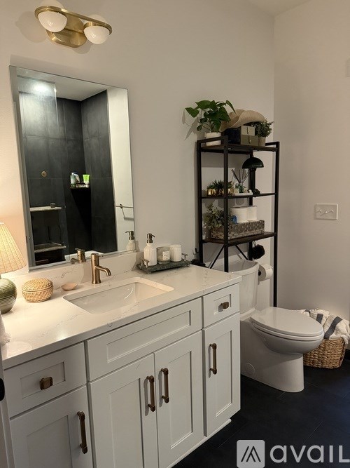 A modern outdoor seating area with a fire pit in the center.