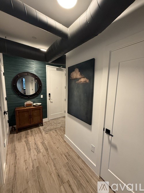 A kitchen with a white counter and a refrigerator.